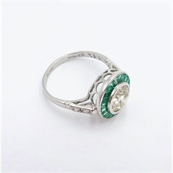 White gold emerald and diamond circular ring, hallmarked 14ct, central diamond 1.12 carat   
