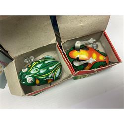 Twenty six tinplate models to include Ferris Wheel and Performing Circus Elephant, marked JW, further similar examples such as Duck on a Bike, Clown on Roller, Carousel; Popeye Tin Speedboat; Looney Tunes Wind Up Cars and Express Train; various international examples, MS107 Jumping Bambi, Pop Pop Boat, jumping frogs, pecking chickens etc; both boxed and loose