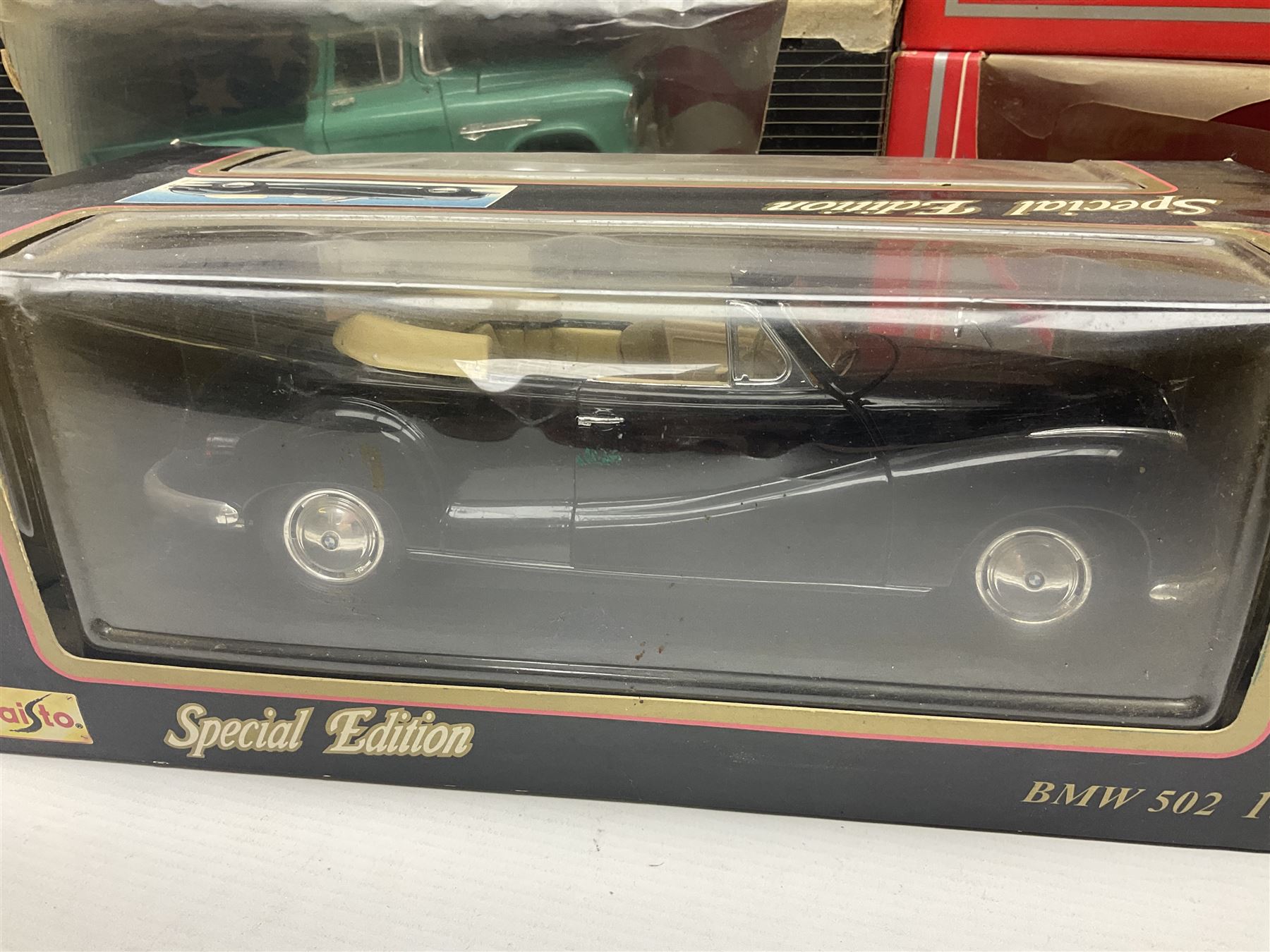 Seven 1:18 scale die-cast models by Ertl, Road legends, Maisto, Solido etc including two Coca Cola promotional vehicles; five boxed (7)