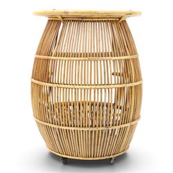 Italian mid-20th century barrel-shaped bar cart in rattan and bamboo, the circular top with rattan and bamboo handle, above a rattan shelf with bamboo bottle dividers below, raised on castors