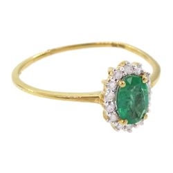18ct gold oval cut emerald and round brilliant cut diamond cluster ring, stamped 750