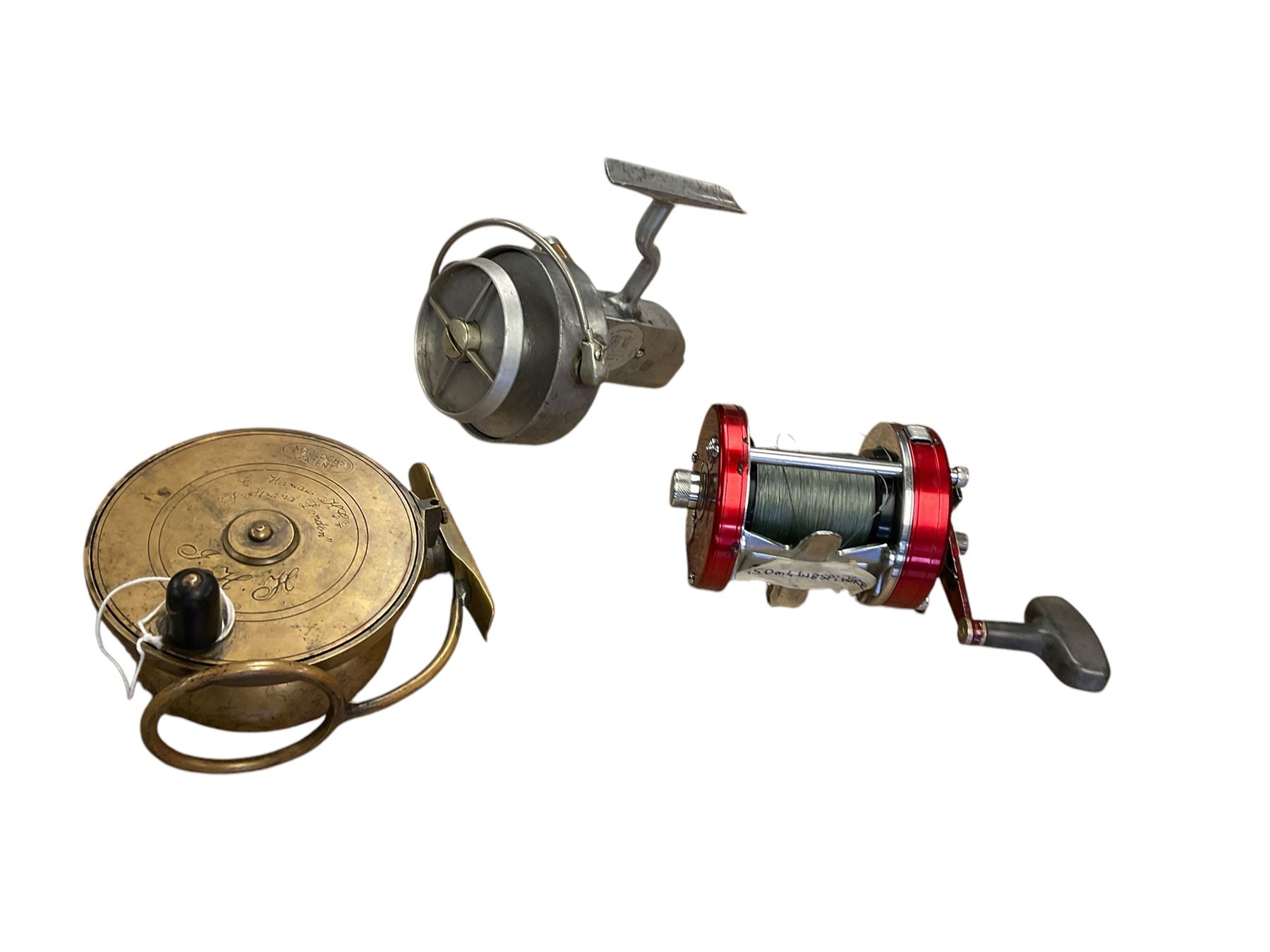 Three fishing reels, comprising Abu Ambassadeur 7000 multiplier, Hardy 'Altex' Fishing Reel and fishing reel measuring marked Mallochs patent & Strand London 