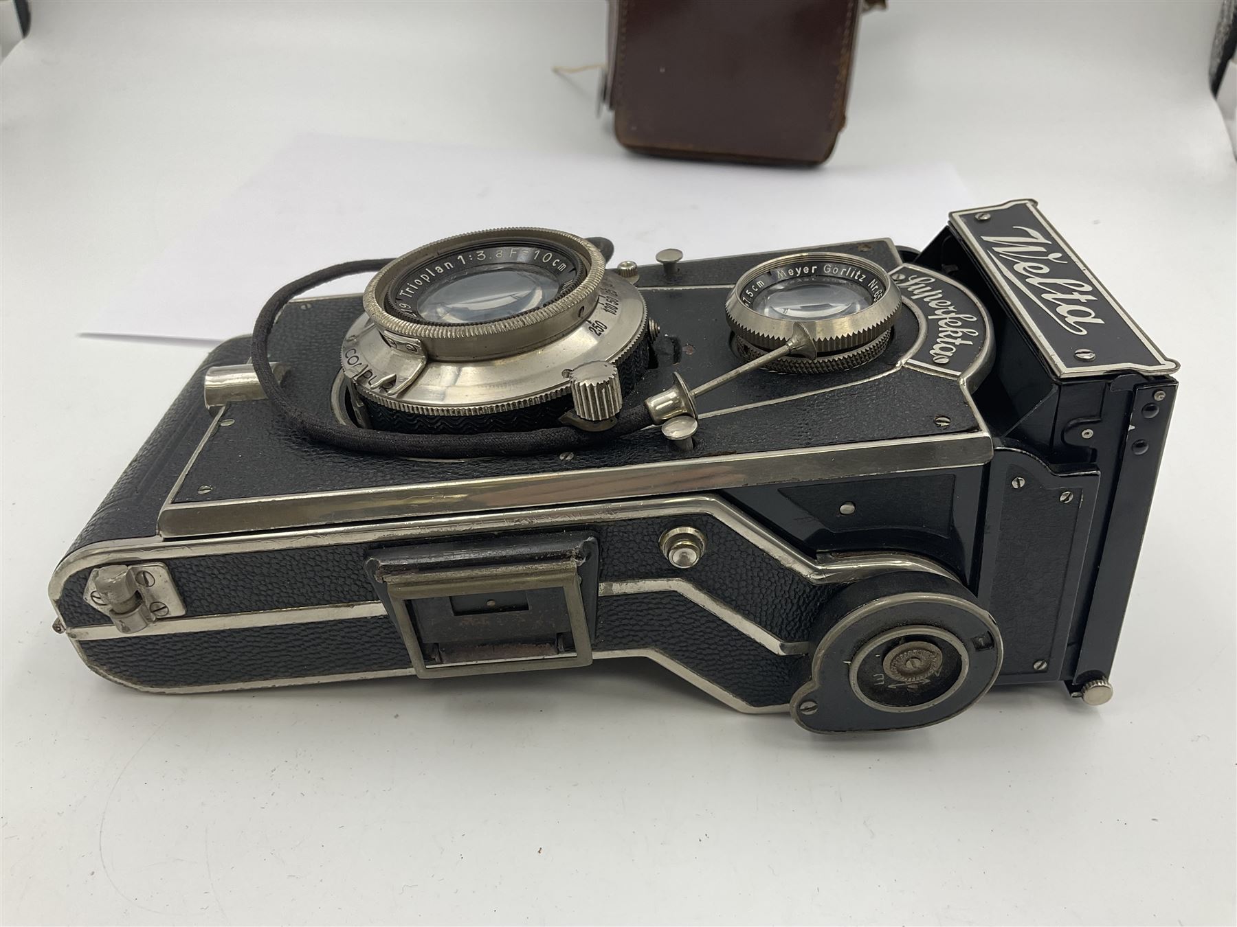 Welta Superfekta Folding twin lens camera, with 'Meyer Gorlitz Trioplan 1;3.8 f=10cm' lens serial no 649219 and 'Meyer Gorlitz Trioplan 1;3.8 f=7.5cm' lens serial no 653168, in fitted case