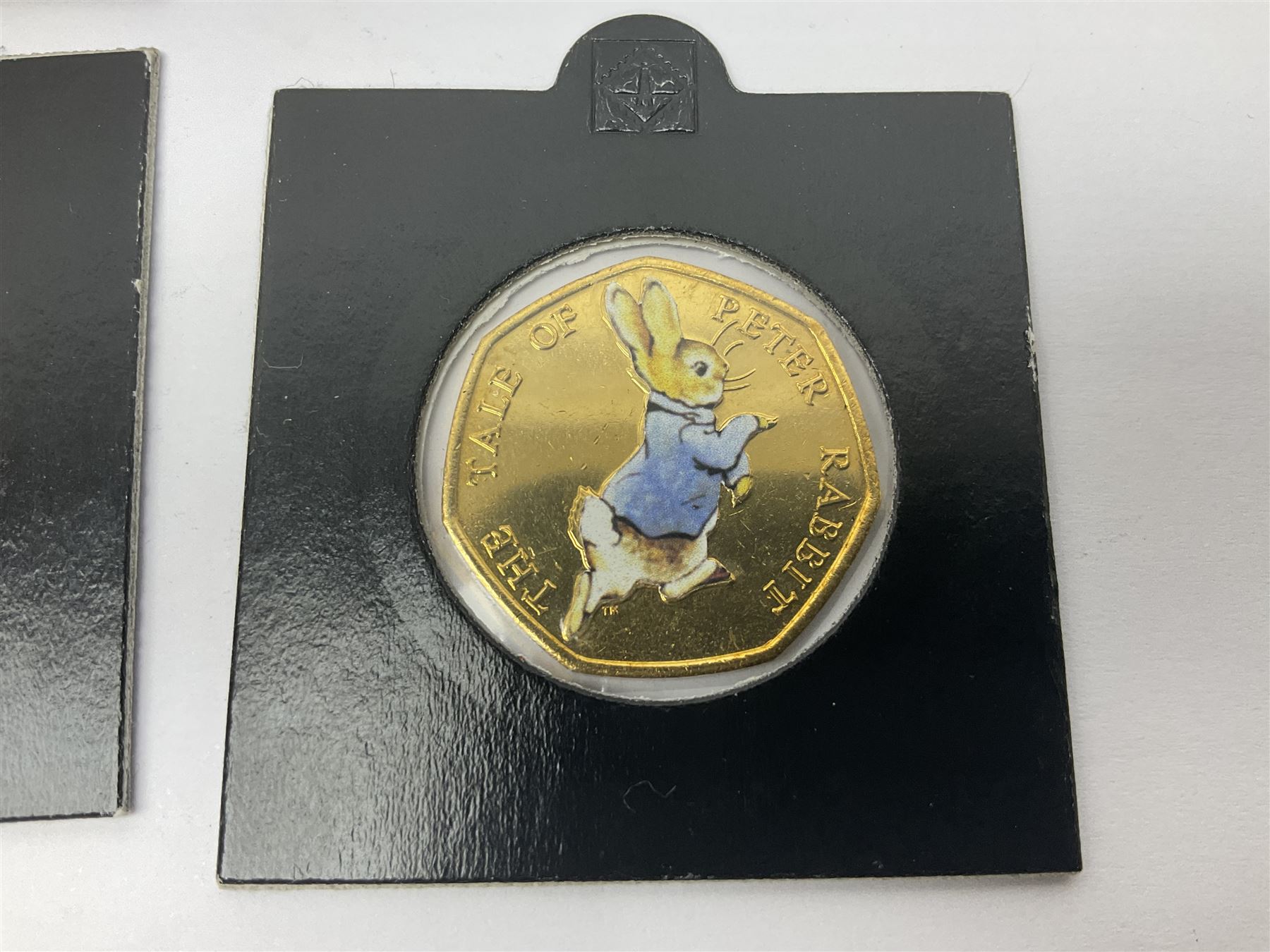 Four gold plated and coloured commemorative fifty pence coins, comprising 2017 Benjamin Bunny, Mr Jeremy Fisher, Tom Kitten and The Tale of Peter Rabbit, with Gold Strike certificate of authenticity