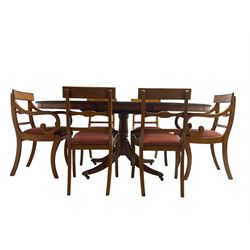Regency design yew wood dining table, oval cross-banded top with reeded edge, raised on turned pedestal with reeded sabre supports terminating in brass hairy paw feet and castors (W138cm D100cm H75cm); and Rackstraw - set six (4+2) Regency design dining chairs with red drop-in seats (W50cm H86cm)