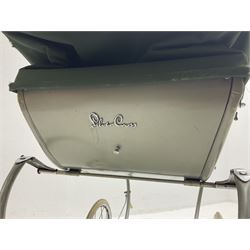 Silver Cross coach-built doll's pram with green fold-down hood and cover, sprung tubular frame, chrome and white handle, four spoked wheels with brake, mattress, pillow and bedding L97cm