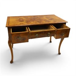 Queen Anne Design walnut kneehole desk with matching chair, rectangular figured top with crossbanding, three frieze drawers, raised on cabriole supports, the chair with serpentine front raised on cabriole supports