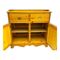 Victorian design pine dresser, projecting moulded cornice over scalloped frieze and two open shelves, base fitted with two drawers over double cupboard, on shaped plinth base