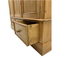 Solid pine triple wardrobe with three drawers