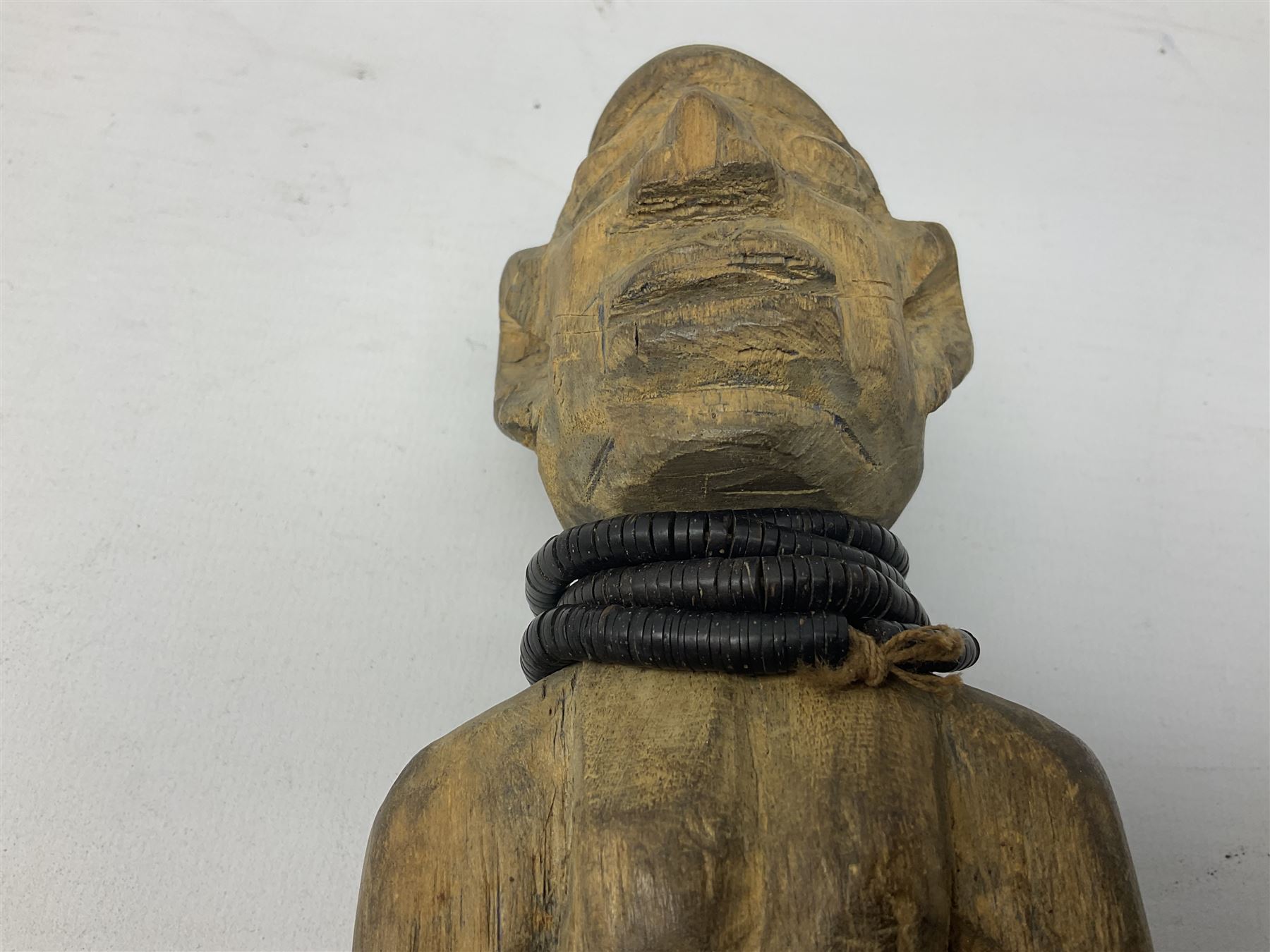 Early 20th century West African Yoruba family wooden figure of Orisha Oko, the god of farming/agriculture, carved from the solid, bears manuscript label of provenance verso H26.5cm