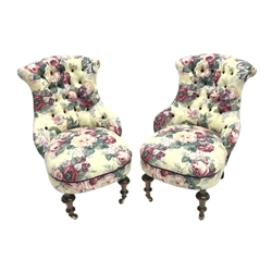 Pair early 19th century buttoned back waisted occasional chairs on turned walnut supports terminating in brass mounted ceramic castors, upholstered in vintage floral Sanderson 'Beaulieu' with complementary aubergine velvet backs (sprung seats completely renewed), total height - 83cm, seat height - 45cm