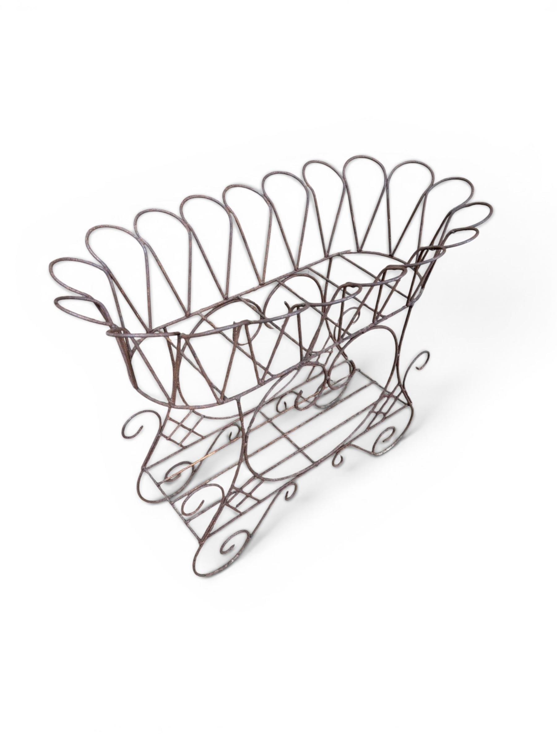 Mid-20th century wirework garden planter, oval form with heart shaped centre, under-tier shelf above scrolling feet