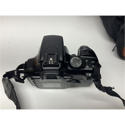 Four camera bodies, to include, Ricoh KR-10 serial no. 38826, Pentax MZ-M serial no. 4185969 with 'SMC Pentax- M 1:3.5 28mm' lens, Canon EOS500 serial no. 080927, with 'Sigma Zoom 100-300mm 1:4.5-6.7 DL'  lens etc, with other camera lenses and equipment 