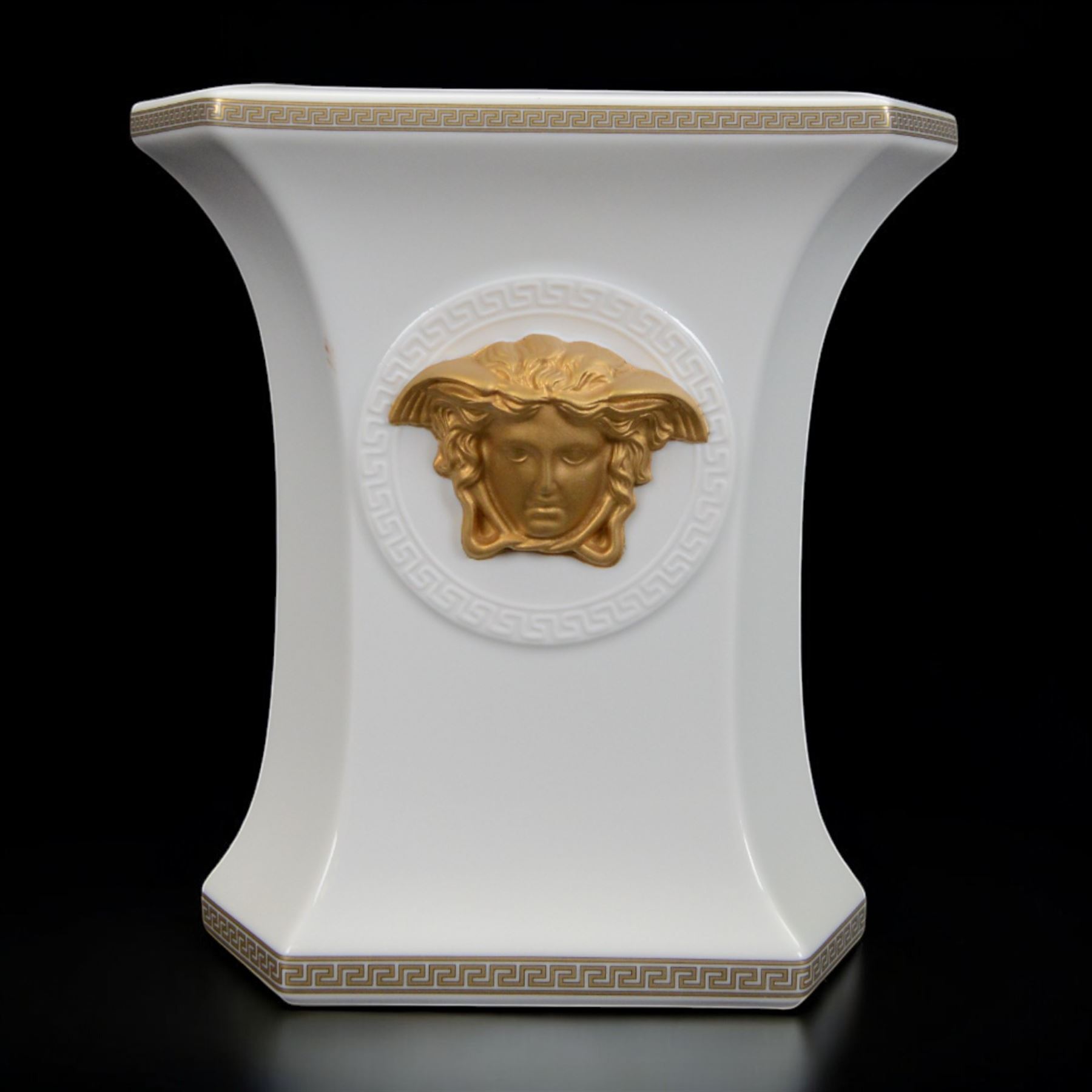 Rosenthal Versace Gorgona vase, of rectagular form with fluted base and rim, decorated in relief with medusa masks and gilt greek key borders upon a white ground, boxed, H19cm
