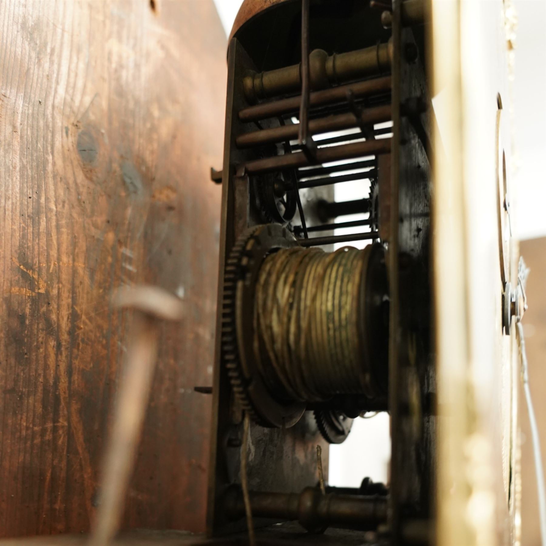 Samuell Hollyar of London - mid-18th century, figured mahogany Longcase clock with a swan neck pediment and brass parterre, with glass panels to the sides and reeded pilaster flanking the hood door, conforming recessed pillars to the trunk and a wavy toped door with  inlay, square plinth raised on bracket feet, With a brass dial with cast spandrels and makers name to the arch, matted dial centre with steel hands, seconds dial and date aperture, silvered chapter with Roman numerals, five minute Arabic's, minute and inner quarter hour tracks, dial pinned to an 8-day rack striking movement, sounding the hours on a bell. With weights and pendulum.
Samuel Hollyar is recorded as being apprenticed in London in 1683 and a member of the clockmakers company 1705-20.