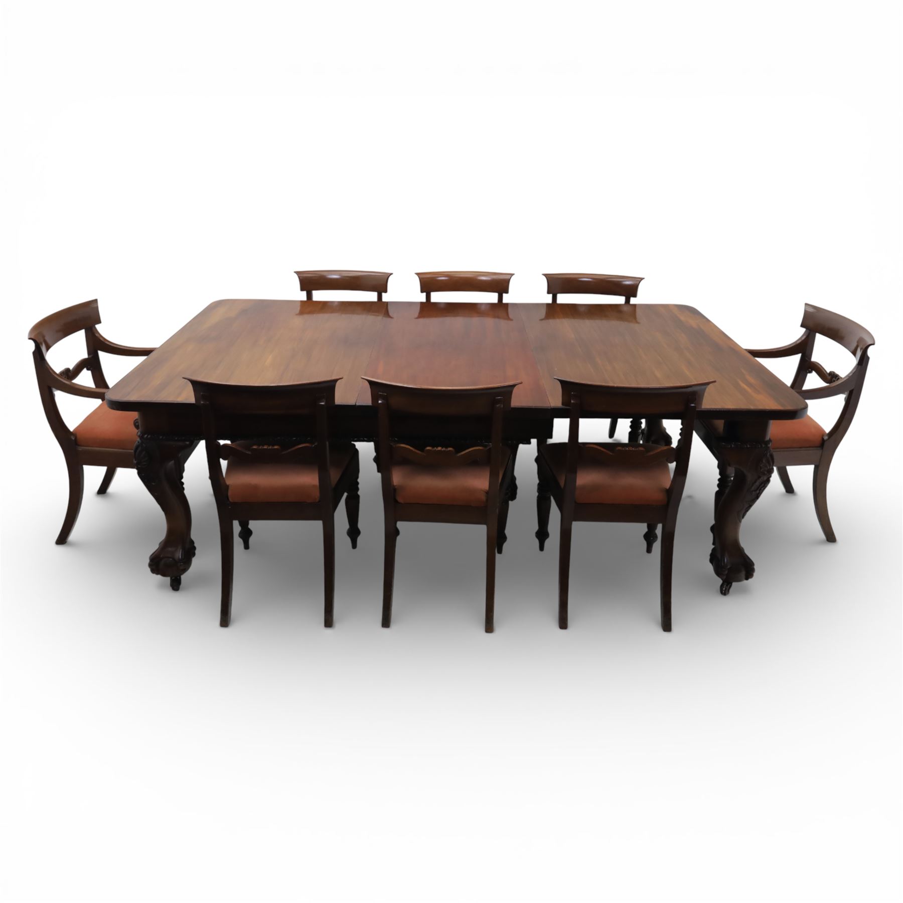 19th century mahogany extending dining table and eight chairs, rectangular top with rounded corners and additional leaves, plain frieze with carved gadrooned edge detail, raised on cabriole supports terminating in ball and claw feet, together with a set of eight mahogany dining chairs including two carvers, the chairs with curved top rails and pierced splats, upholstered drop-in seats, on turned supports

(Table extends to 312cm)