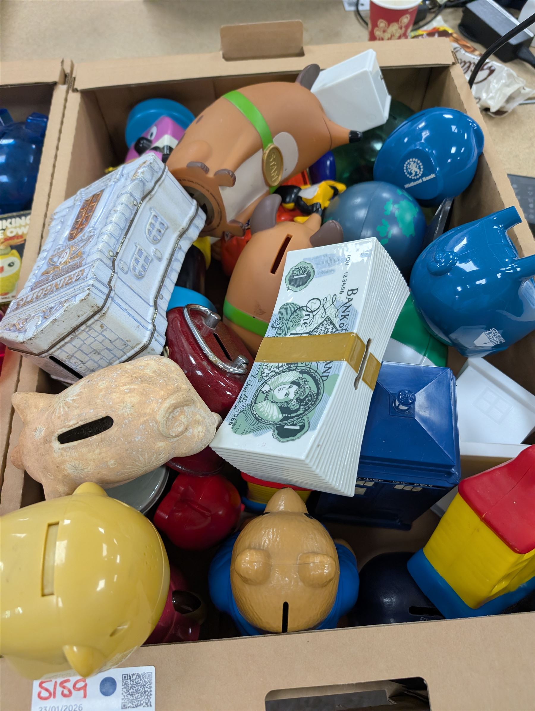 Large collection of vintage money boxes and charity boxes, including plastic, wooden, tin and ceramic examples, of various designs including Paddington, Dunlop, Jellybabies, Meerkat, Halifax Houses, Pigs, etc
