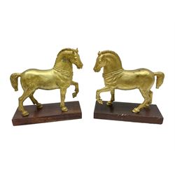 Pair of Grand Tour style, gilt metal horse after the Triumphal Quadriga or Horses of the Hippodrome of Constantinople St Marks Balilica, set on a wooden plinths, H18cm