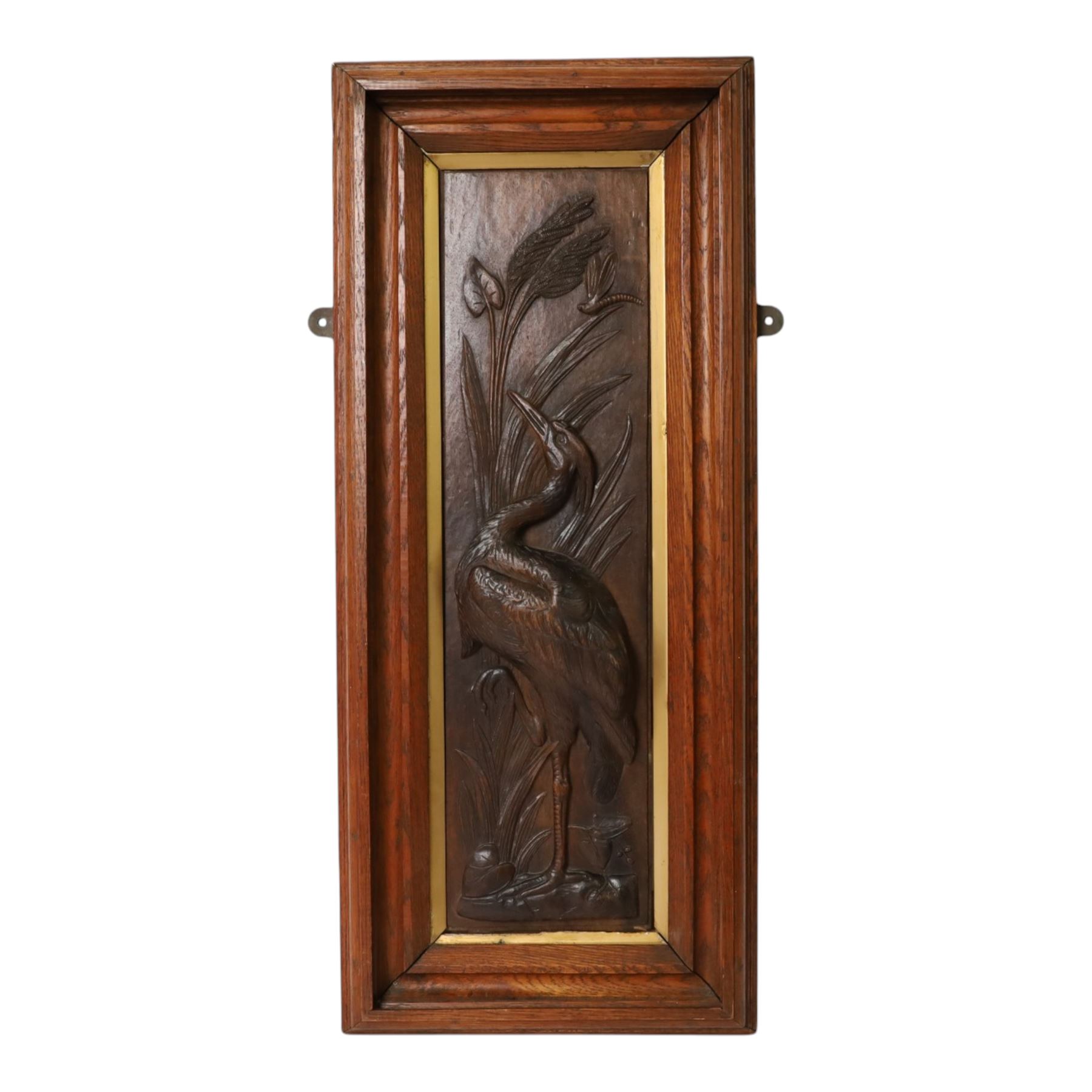 After Leander Plummer II, carved wooden panel of a stork amongst reeds, within a wooden frame, H80cm