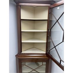 19th century mahogany corner display cabinet, projecting cornice above two astragal glazed doors, enclosing lined interior with five shelves, shaped bracket supports 