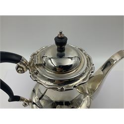 1920s five-piece silver tea service, comprising teapot, coffee pot, hot water pot, twin handled open sucrier and milk jug, each of squat circular form with shaped rim, the teapot, coffee pot and hot water pot each with ebonised handle and finial, the sucrier and milk jug with acanthus capped scroll handles, all upon circular foot, hallmarked R F Mosley & Co, Sheffield 1926 & 1927, tallest H24cm
