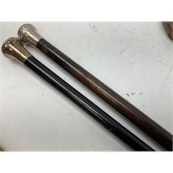 Collection of Victorian and later walking sticks and canes to include five silver mounted examples with hallmarks for Birmingham and London etc, umbrellas etc
