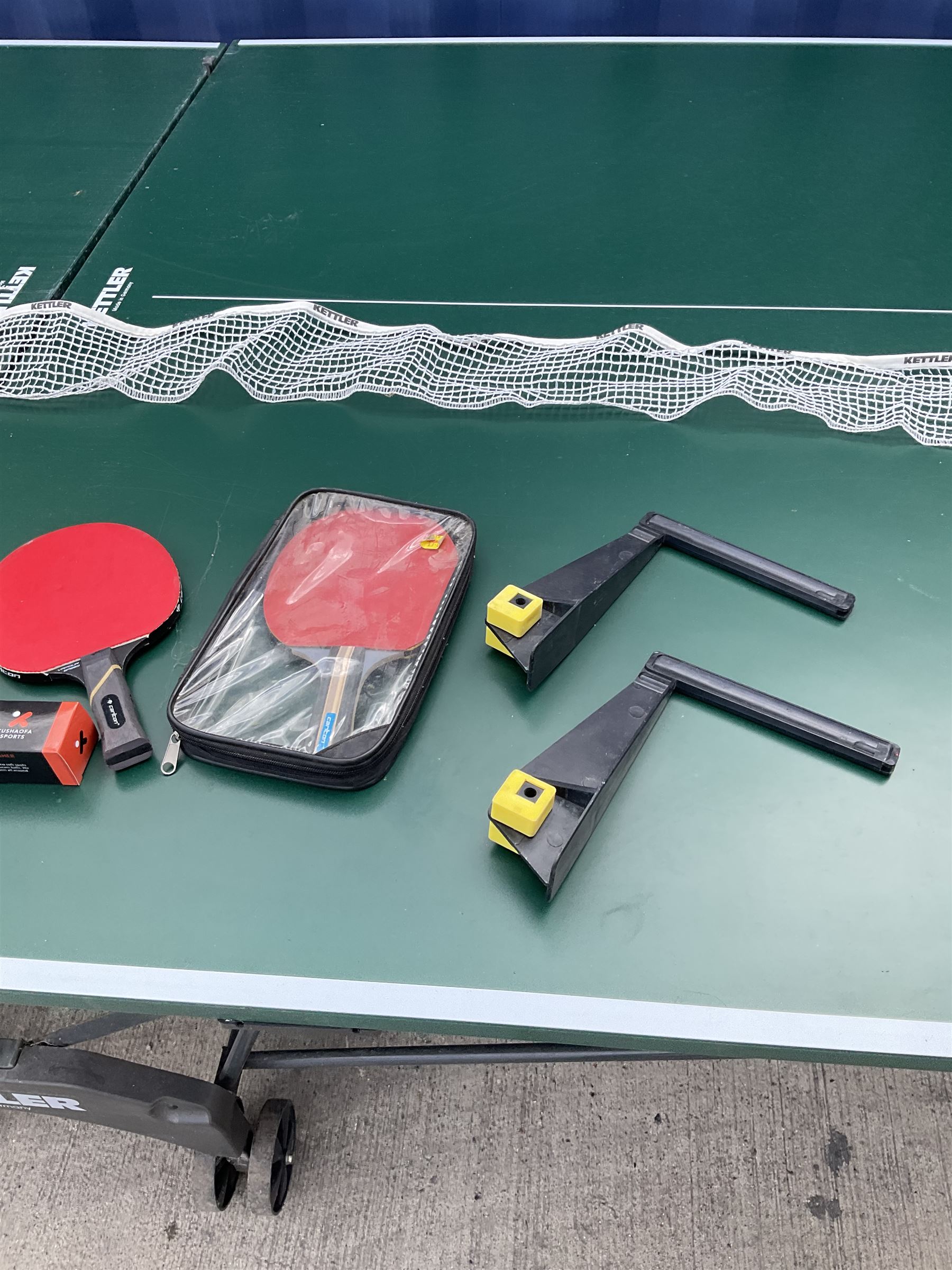 Kettler Riga outdoor tennis table with waterproof cover, net, bat and balls, 153cm x 275cm - THIS LOT IS TO BE COLLECTED BY APPOINTMENT FROM DUGGLEBY STORAGE, GREAT HILL, EASTFIELD, SCARBOROUGH, YO11 3TX