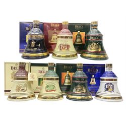 Bells, 8 year old, Scotch whisky, in Seven Wade ceramic decanters, comprising christmas decanters 1994, 1995, 1996, 1997 and 1998, Golden Wedding anniversary of the queen and the duke of Edinburgh decanter and the prince of wales 50th birthday decanter, all 70cl, 40% vol, all in original boxes