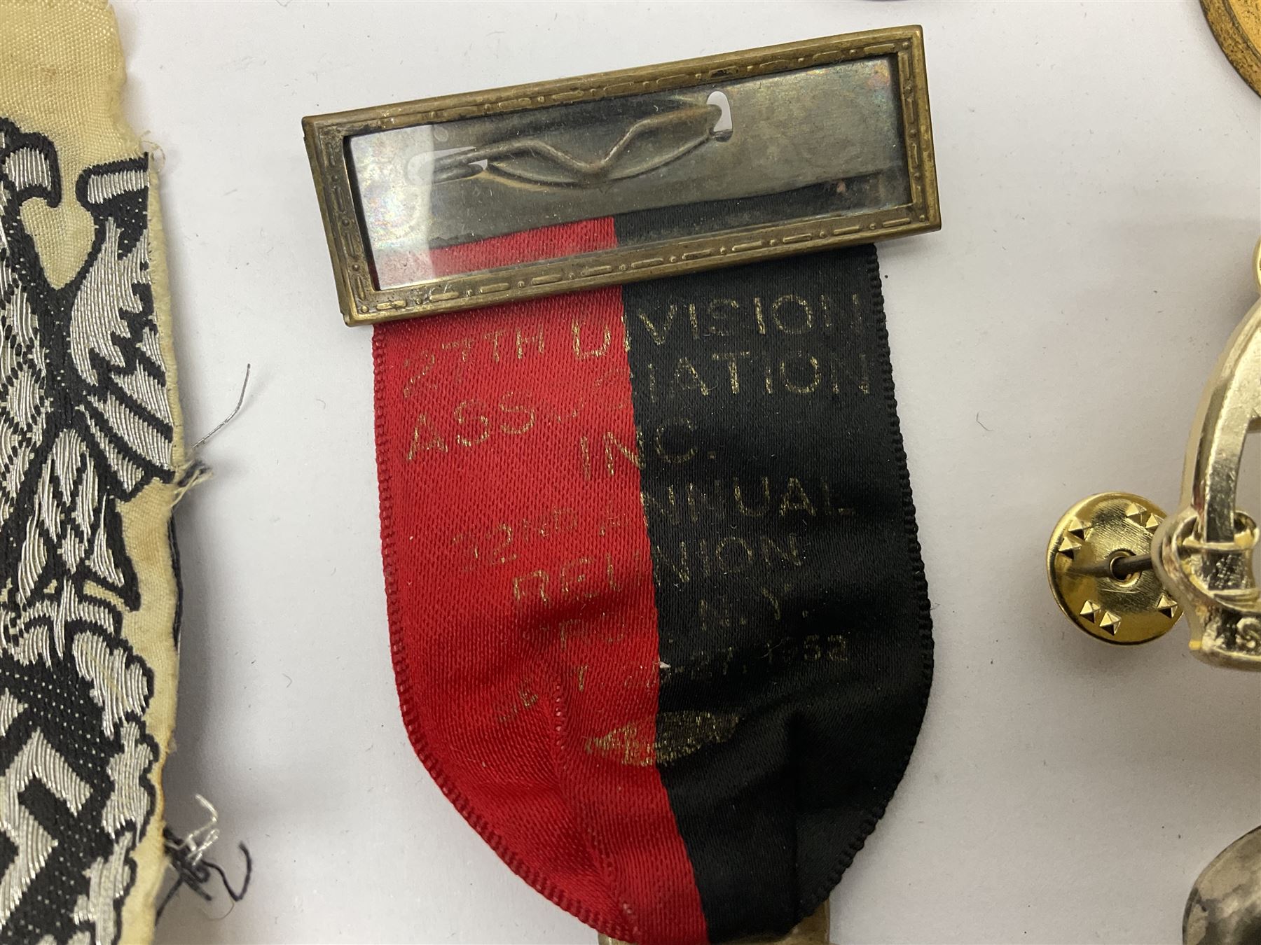 Collection of approximately sixty worldwide medals, metal badges, belt buckles, cloth badges, trench art, brass button stick etc