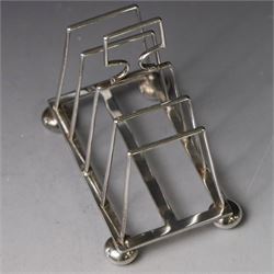 Victorian silver toast rack, with five angular bars and loop handle, upon four squat bun feet, hallmarked Thomas Hayes, Birmingham 1893, height including handle H10cm