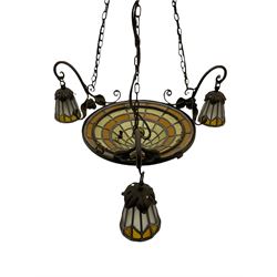 Art Nouveau style wrought metal ceiling light fitting, dome leaded glass central shade, three scroll branches decorated with roses, each with matching leaded glass shades