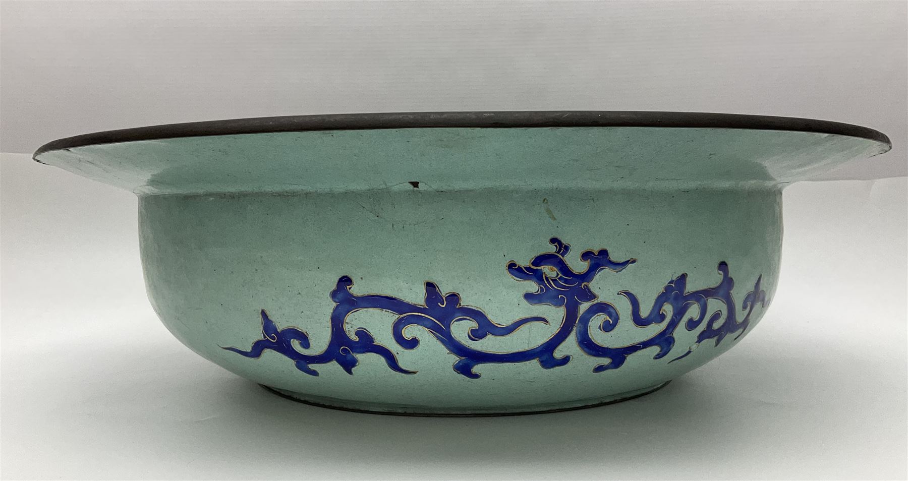 18th/19th century Chinese Canton enamel basin, the circular basin with flat everted rim, decorated with scrolling foliate and fruit decoration on a blue ground, D43cm