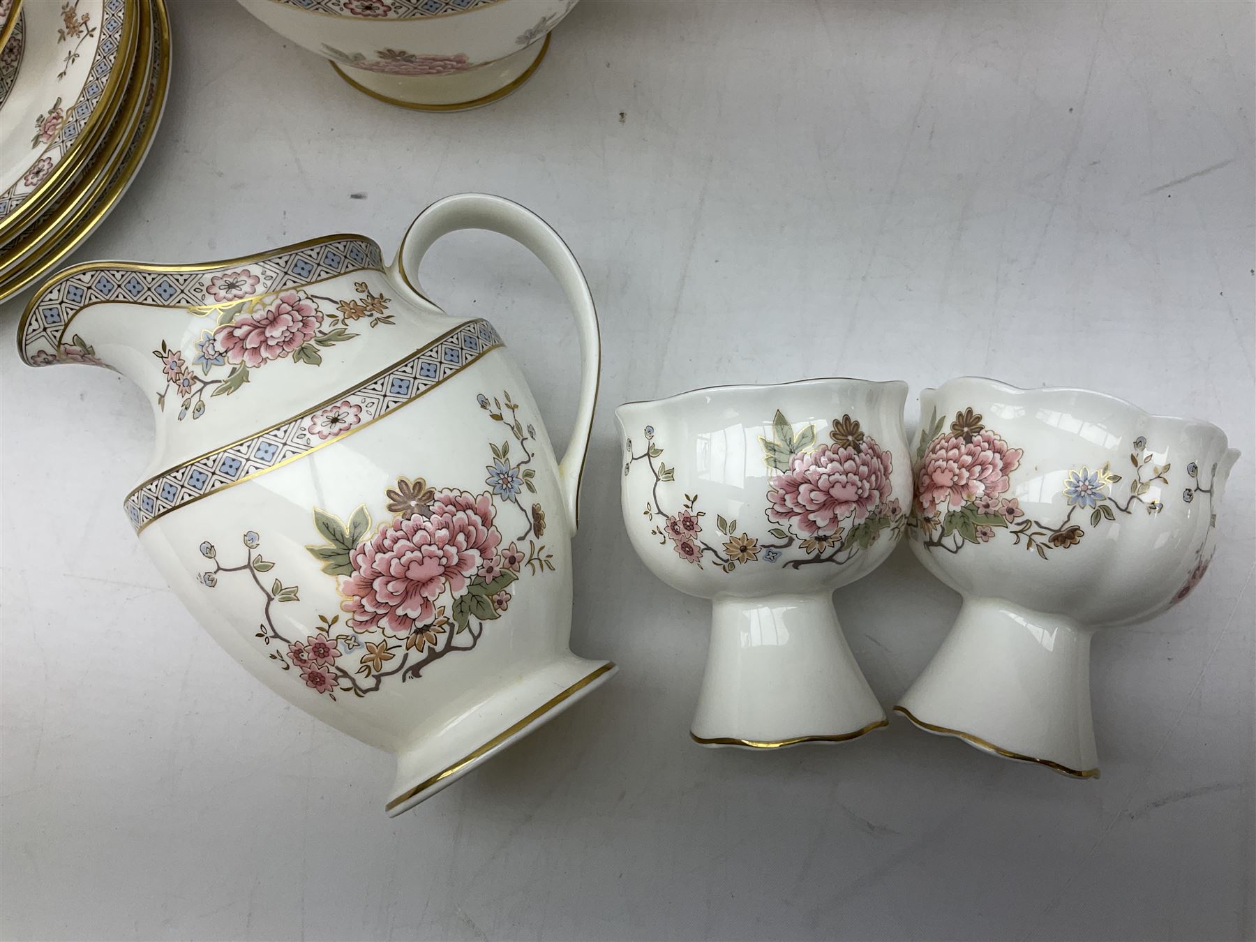 Royal Doulton Canton pattern tea and dinner wares comprising teapot, milk jug, twin handled lidded sucrier, cake plate, six dinner plates, six side plates, five smaller plates, five saucers and pair of candlestick holders, together with Sevres clear glass decanter with faceted sides and stopper, all with marks beneath