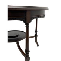 Early 20th century mahogany centre table, circular moulded top with satinwood band decorated with scrolling and interlaced foliate inlay, acanthus scroll carved skirt, on turned and carved supports with out splayed square feet, joined by circular dished under tier 