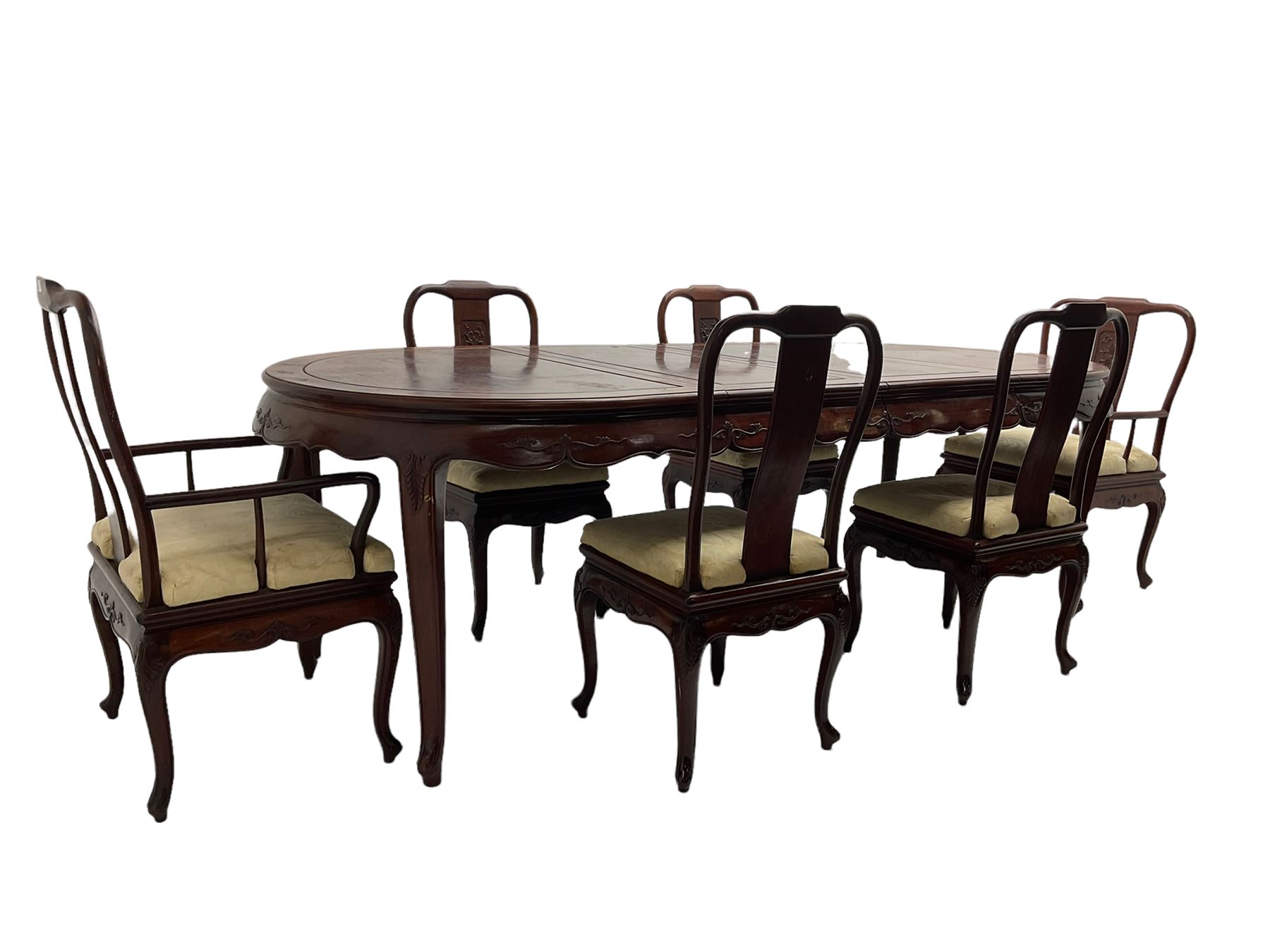 Mid to late 20th century Chinese hardwood extending dining table, two additional leaves, shaped apron carved with foliate scrolls, leaf carved cabriole supports (W246cm, H78cm, D117cm), and set six (4+2) dining chairs with shaped cresting rails over carved splats