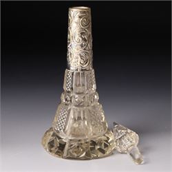 Silver upright photograph frame, aperture size 14cm x 9.5cm Birmingham 1919, pair of glass scent flasks with silver collars H16cm , two others, two dressing table jars with silver covers and a silver candlesticks