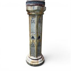 Farran stone garden statue depicting a hooded monk standing in flowing robes in circular form, set upon Gothic pedestal with arched panels, featuring lead hands and script band