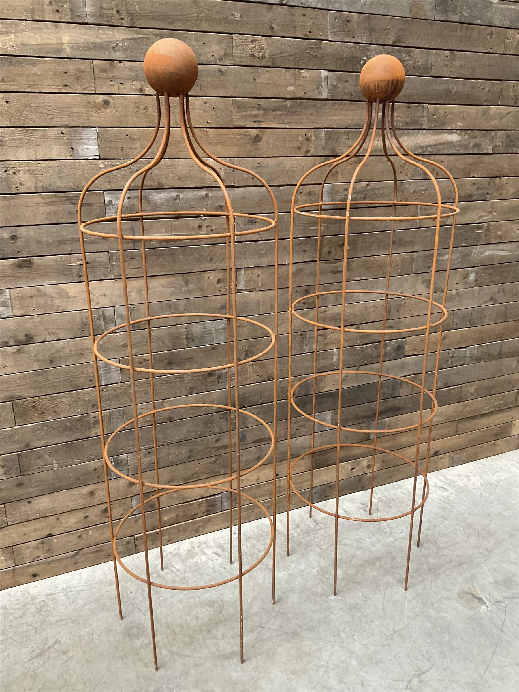 Pair of Country House wrought iron garden obelisks with ball finial, raise in four tiers