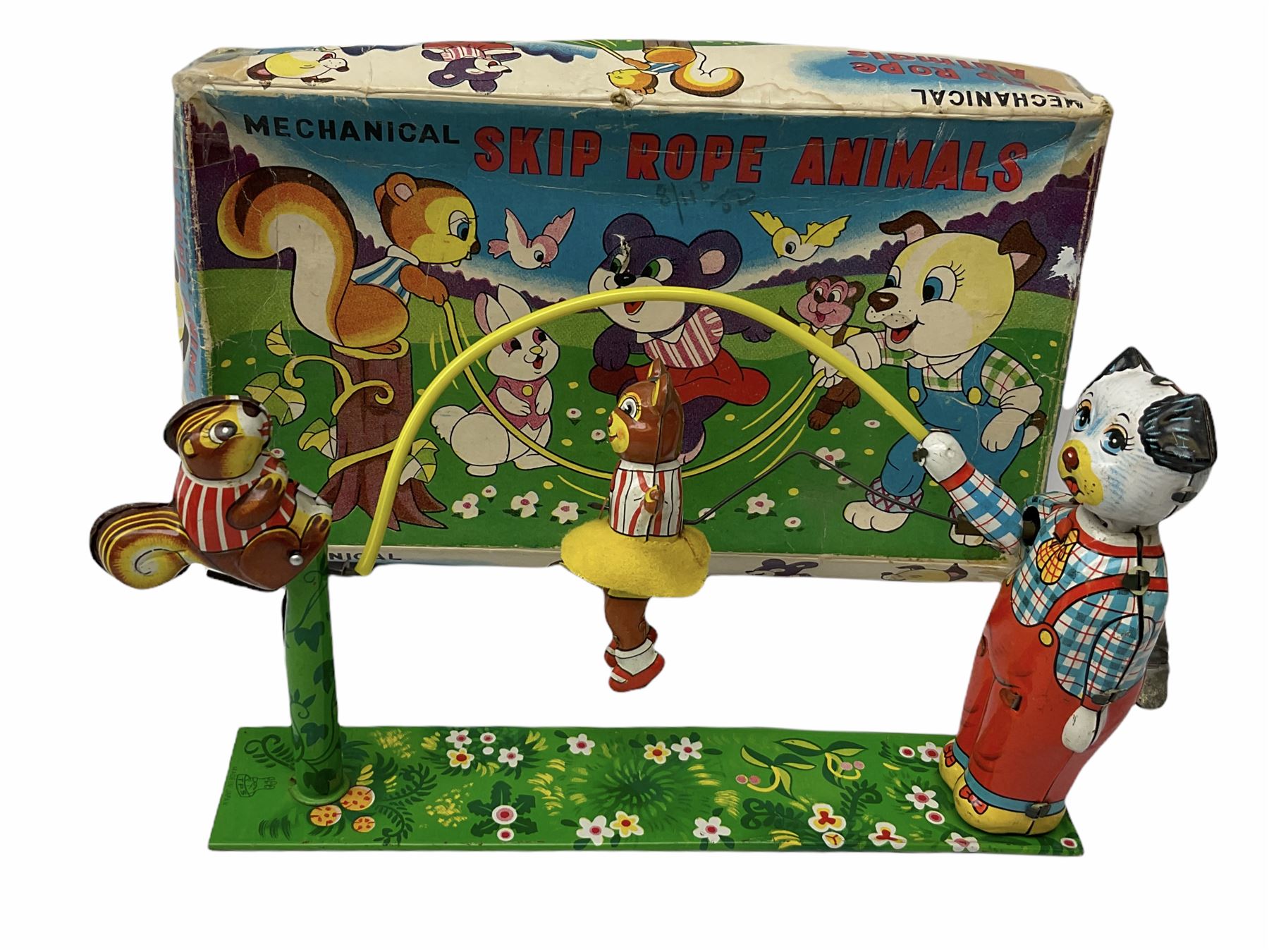 Gebruder Bing Germany Pigmyphone child's portable toy gramophone in woodgrain finish tin-plate box with key and tin of needles L15cm; and nine small records of nursery rhymes; together with a Japanese tin-pate 'Skip Rope Animals' clockwork toy, boxed.