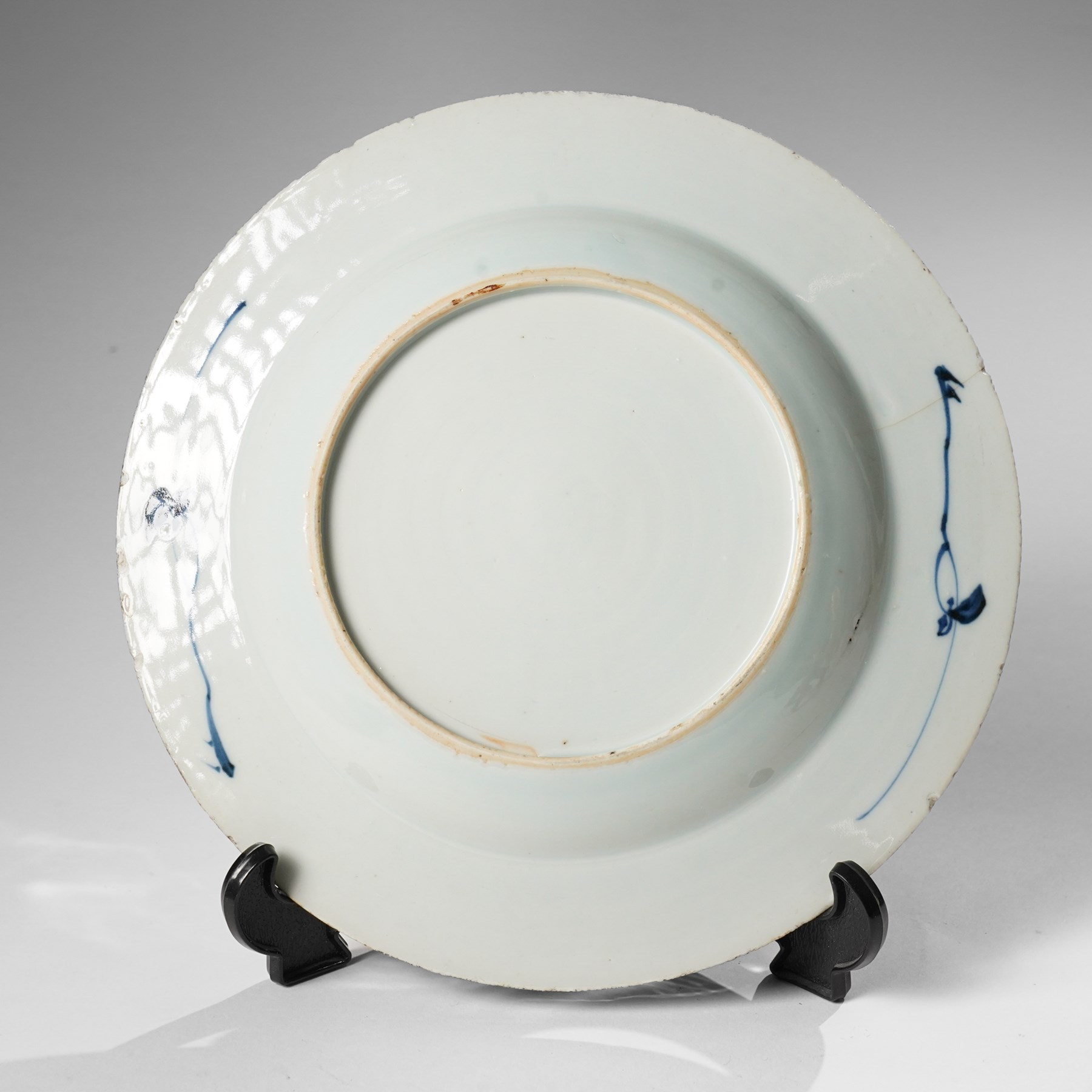 Three Chinese Kangxi period blue and white plates, painted in underglaze blue with various patterns, including Butterfly and Rockery, Pagoda and River Landscape, and floral sprays, each approx. D23cm (3)