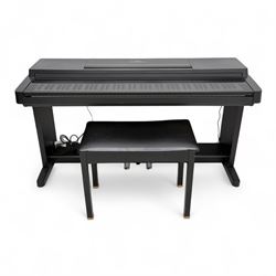 Yamaha Clavinova CLP-550 digital piano, full-size weighted keyboard with integrated pedals and speakers, in dark wood effect casing, accompanied by matching padded bench, Sennheiser headphones, original manuals, and factory-issued cassette tape titled 'Pure & Simple – CLP Digital Pianos'