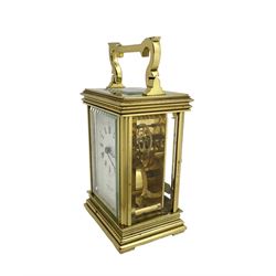 English - late 20th century 8-day carriage clock by Taylor & Bligh, in an Anglaise case with a rectangular handle, bevelled glass panels and enamel dial with Roman numerals, minute markers and steel moon hands, timepiece spring driven movement with a jewelled lever platform escapement. With key.