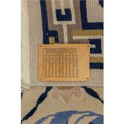 Rugs by Design - Nepalese wool rug, cream field decorated with repeating diamond trellis enclosing scrolling foliate motifs in blue, burgundy and ochre, within chain-link border and fringed ends