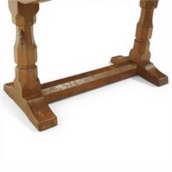 Mouseman - oak rectangular adzed coffee table, octagonal supports united by stretcher terminating in sled feet, with carved mouse signature, by the workshop of Robert Thompson of Kilburn 