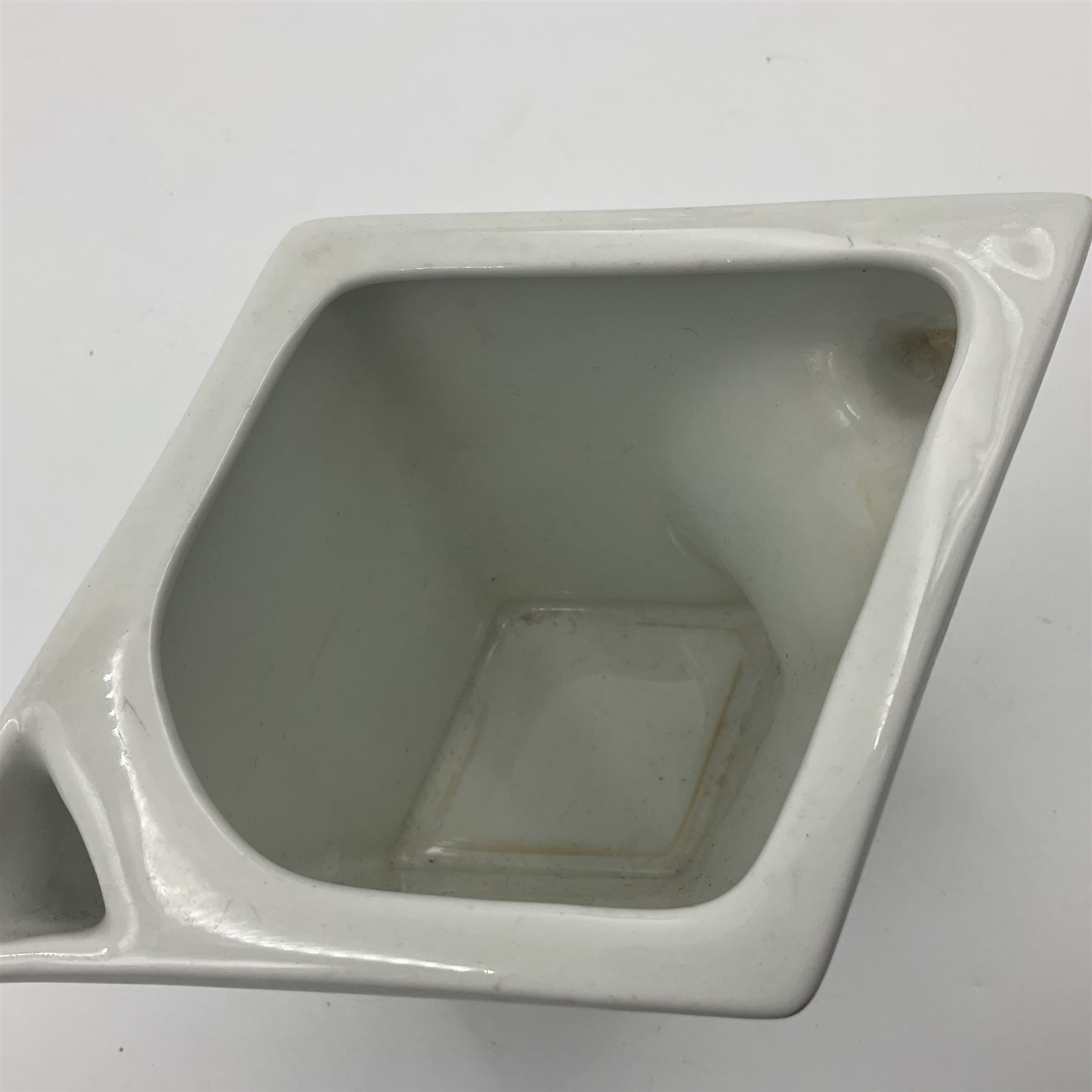 Royal Doulton Guinness advertising whiskey water jug, circa 1930s by Robert Porter and Co. of lozenge angled form, decorated with the  bulldog Guinness, H11cm