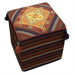South West Persian Qashqai stool, square flatwoven top with central geometric medallion enclosed within a stepped border the sides decorated with striped bands of geometric motifs with tasselled corners 
