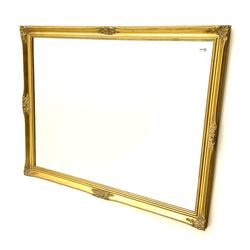 Large wall mirror in gilt swept frame, bevelled glass