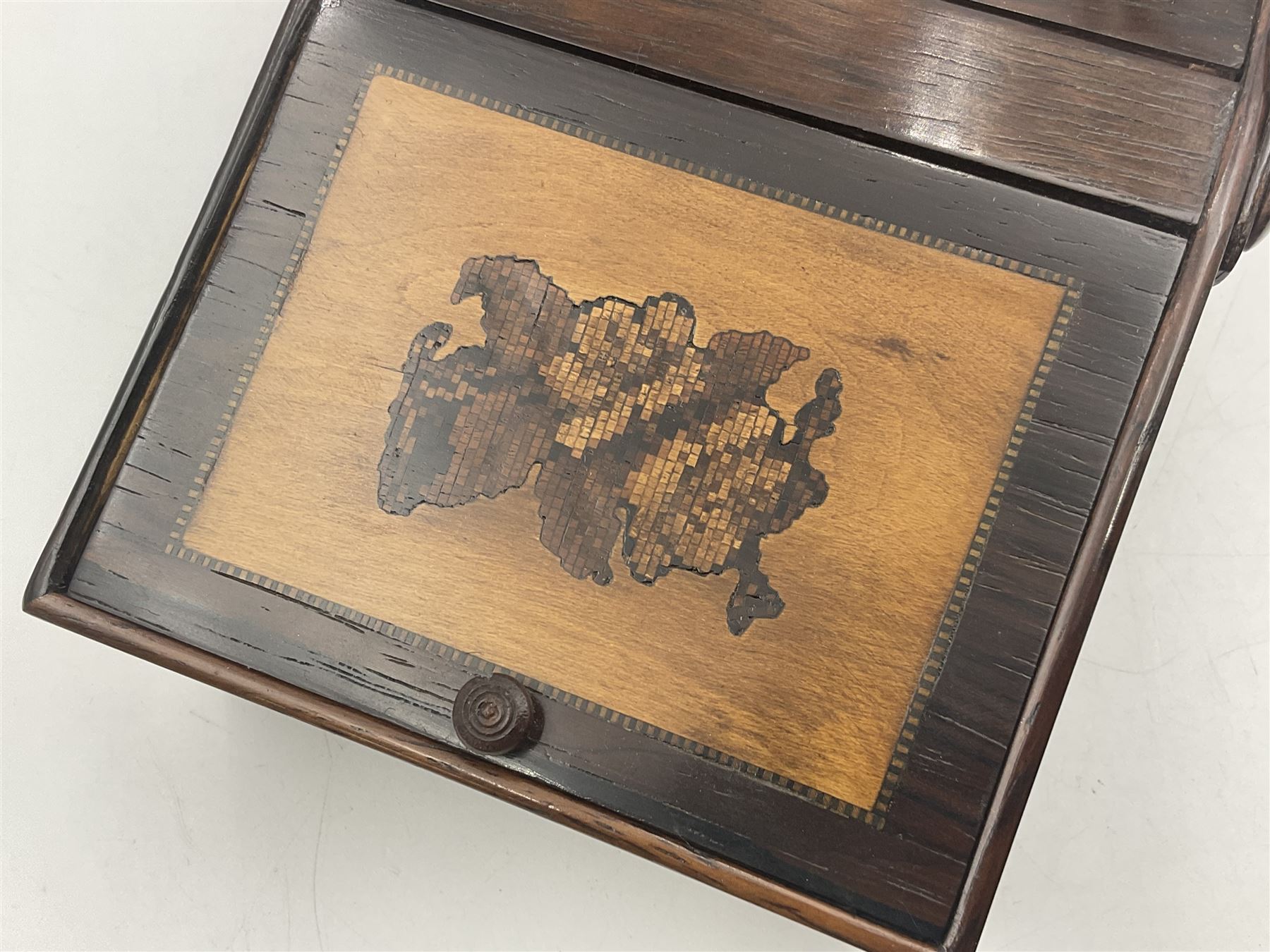 19th century rosewood Tunbridge Ware basket, of rectangular form with curved bentwood handle, and twin hinged sloping covers, lifting to reveal paper lined interiors, not including handle H5.5cm D10.5cm L18cm