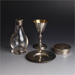 Mid 20th century silver travelling communion set, comprising goblet, paten and pyx, all hallmarked Hurst, Franklin & Co Ltd, London 1961 & 1962, with a glass bottle with unmarked cover, all within a tooled leather fitted case, goblet H9cm