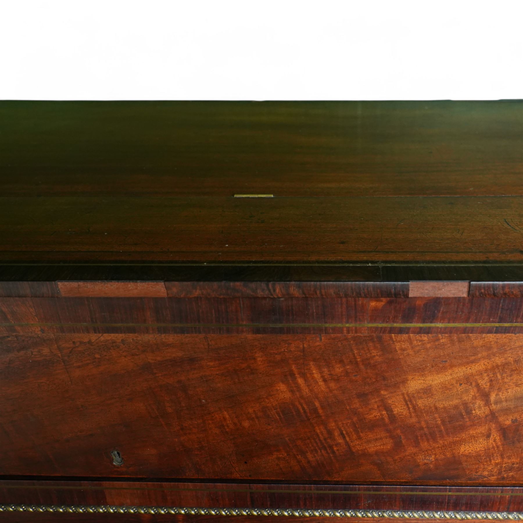 Early 19th century George IV Square Piano by William Rolfe & Co, 112 Cheapside, London, c1821. Mahogany veneered case with rosewood crossbanding and brass stringing, with sustain pedal and reeded legs on a tapered spiral with brass capitals, with three music draws beneath and a folding duet music stand, nameboard with makers name on a round gilt medallion and open silk backed fretwork to the ends, serial No 6699, double strung, English double action with 68 ivory and ebony keys, F1-C7. original strings, hammers and dampers, soundboard and bridge in good condition, with original makers written instructions on regulating the action and tuning the piano attached to the inside of the instrument. In good condition, however the action is in need of regulation and tuning.
William Rolfe is thought to have been in business between 1785 and 1828. 
Given the intricate nature of these historic instruments, specialist support will be available if required, to assist successful buyers with safe removal and onward handling. Price upon application.


This item has been registered for sale under section 10 of the APHA Ivory Act Reference PB6GL6SZ